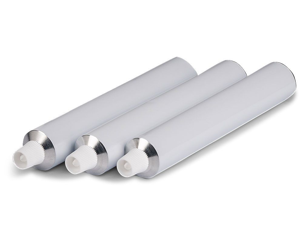 Three filled, unprinted aluminum tubes with white screw caps